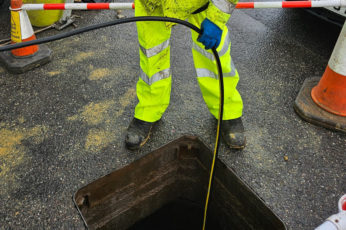 south west water working on drain in road