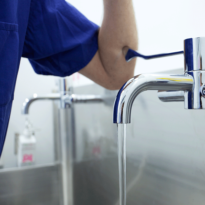 Hospital staff using tap